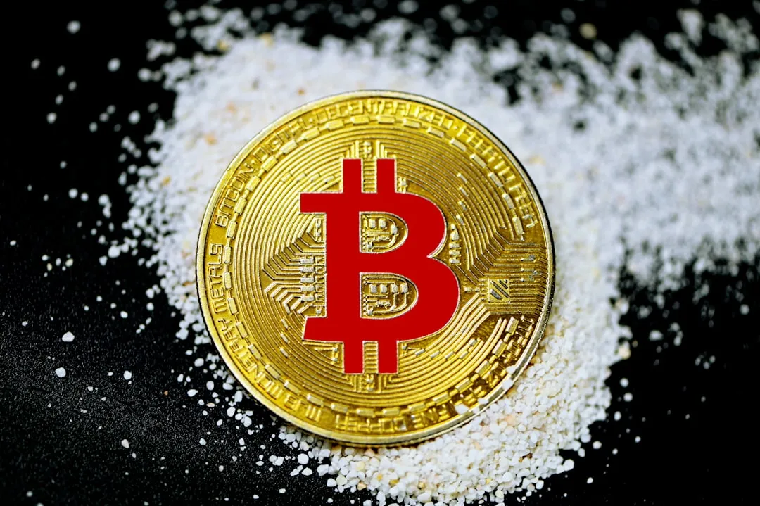 Bitcoin coin balanced on stack of other cryptocurrencies